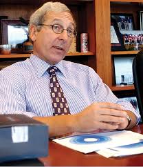 Peter Volanakis at his desk at Corning Incorporated.